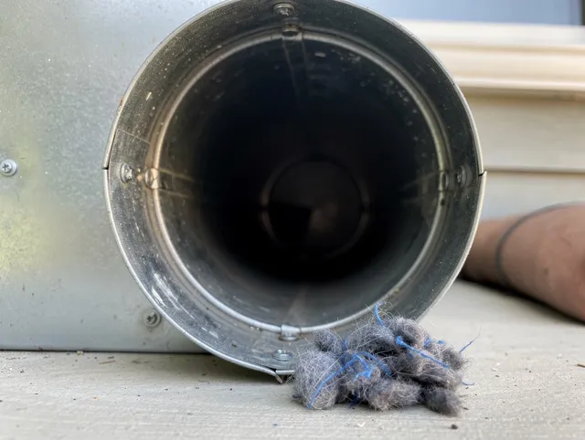 Ansonia Dryer Vent Cleaning technician using specialized equipment to clear severe dryer vent blockage in Ansonia